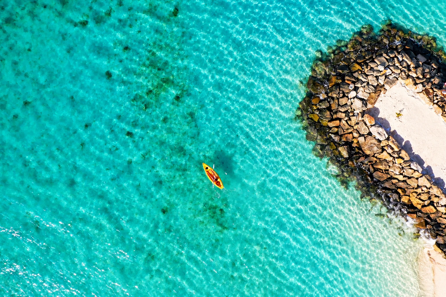 Canoeing beside a tropical island
